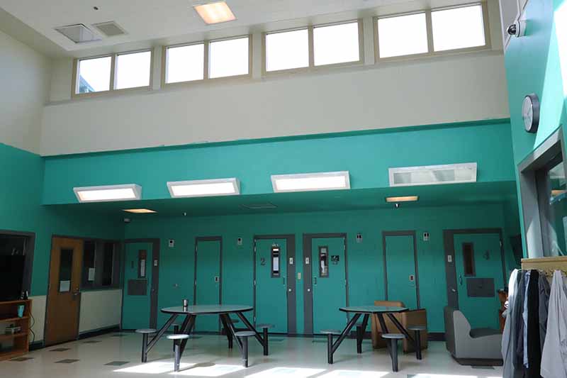 tables inside large room with windows