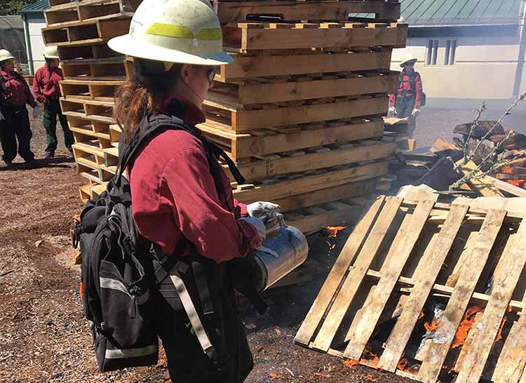 person putting out fire