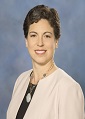Commissioner Letha Tawney smiling