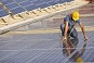 worker installingsolar panels