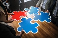Puzzle pieces on boardroom table