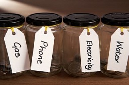 Mason Jars labeled with Utilites Gas, Phone, Electric, Water