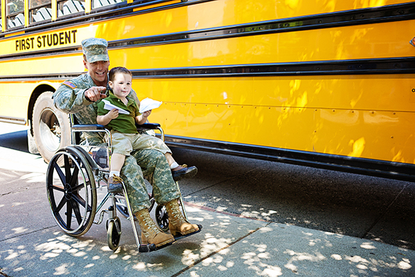 Father in wheelchair with child