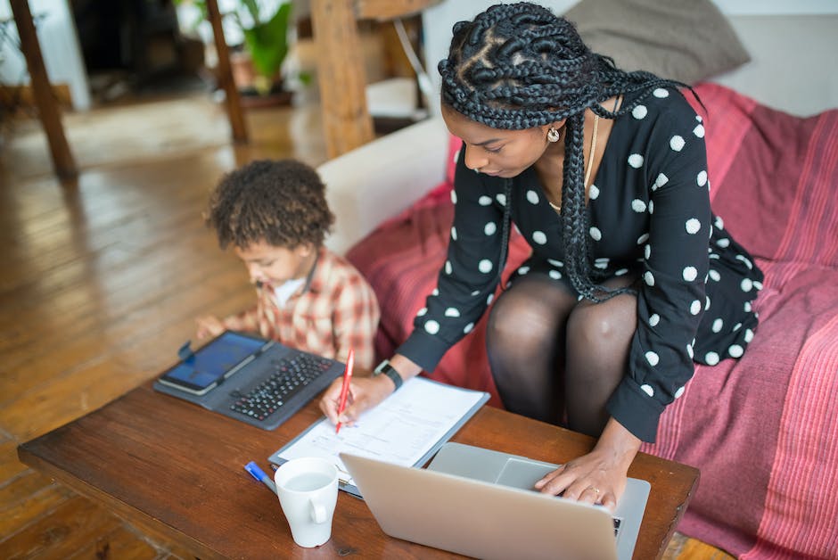 Picture of a Mother and her child working on a laptop