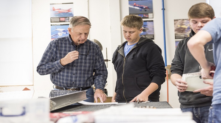 Shop teacher with students