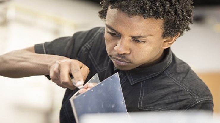 teen working on shop project